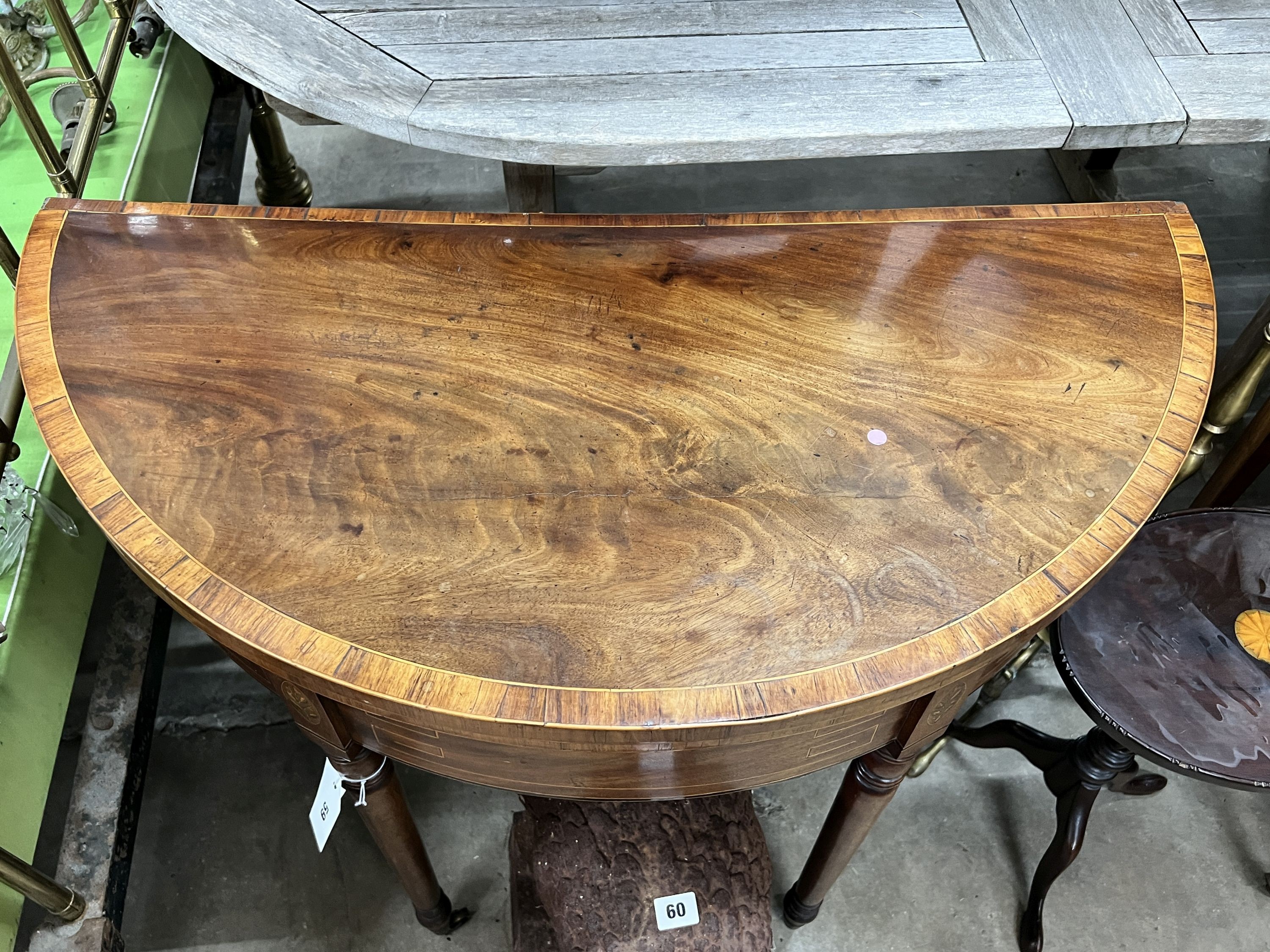 A George III banded mahogany D shaped folding card table, width 91cm, depth 46cm, height 72cm